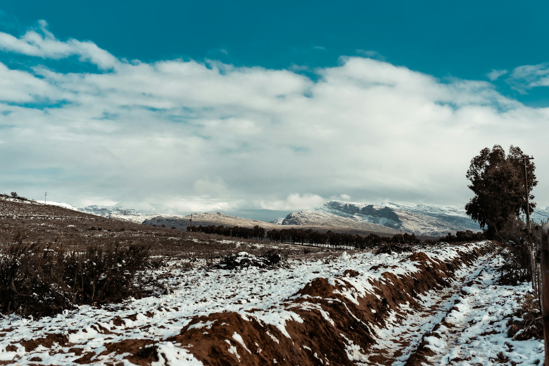 A snow-covered mountain under blue sky
