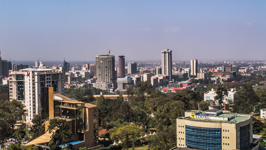 The Nairobi city skyline — modern skyscrapers with green hills behind, Kenya